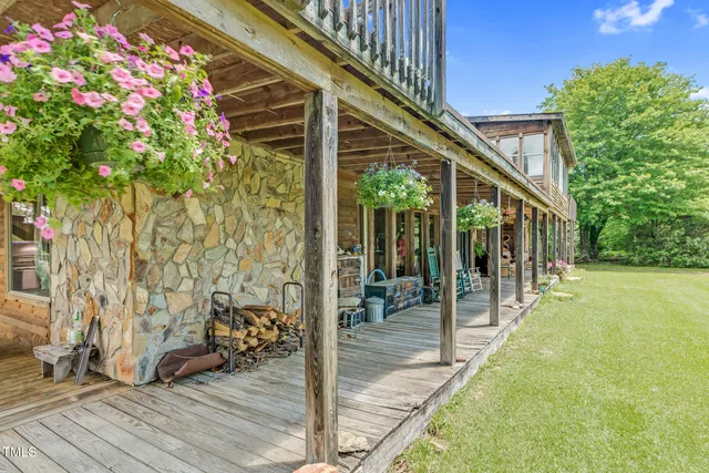 a view of a patio with a table and chairs