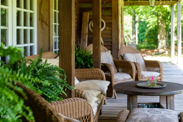 a room with stainless steel appliances kitchen island granite countertop a sink and cabinets
