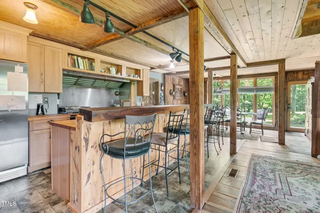 a view of a balcony with furniture and wooden floor
