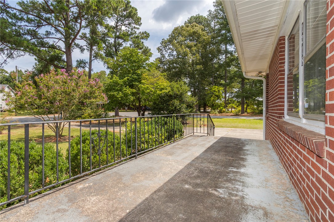 1218 Bolt Drive Anderson, SC 29621 - Photo 6 of 46 An inviting front porch overlooks mature landscaping and a peaceful neighborhood setting.