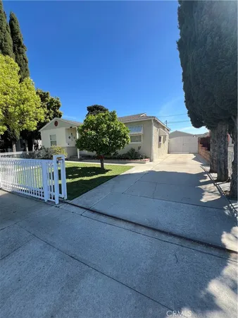 a view of a park with plants and trees