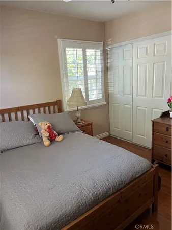 a bathroom with a sink a toilet a mirror and shower