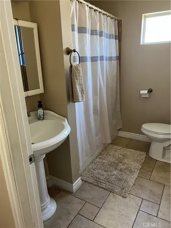 a room with furniture and flat screen tv