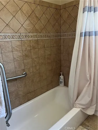 a bathroom with a toilet a sink and a mirror