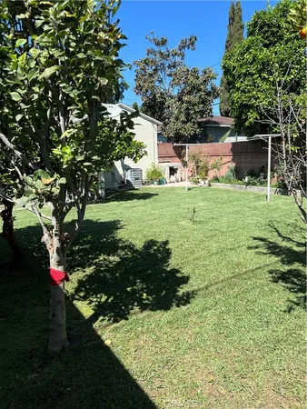 a view of a backyard with sitting area