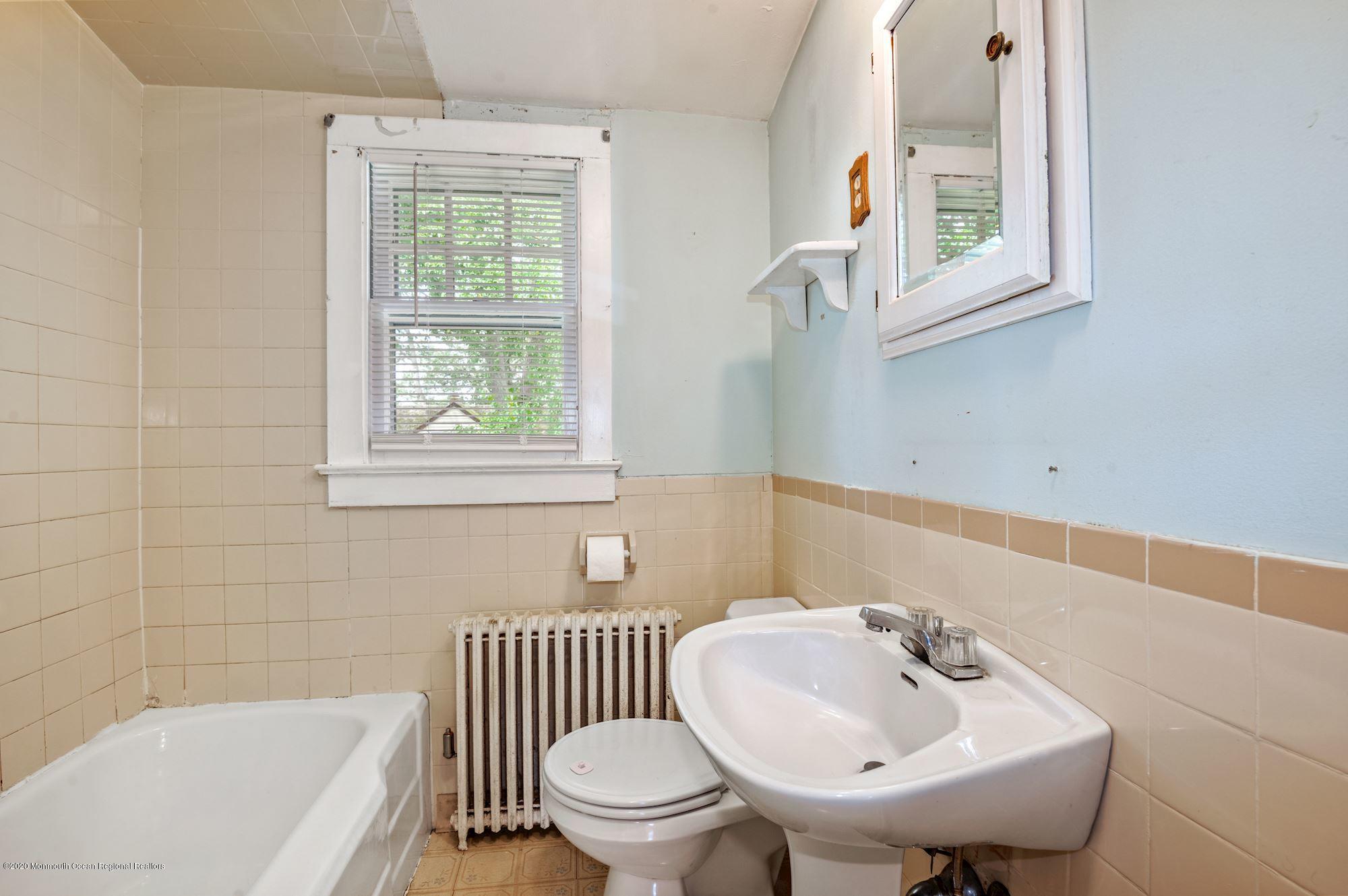 306 Cedar Road Point Pleasant, NJ 08742 - Photo 19 of 28 a bathroom with a sink and a bathtub