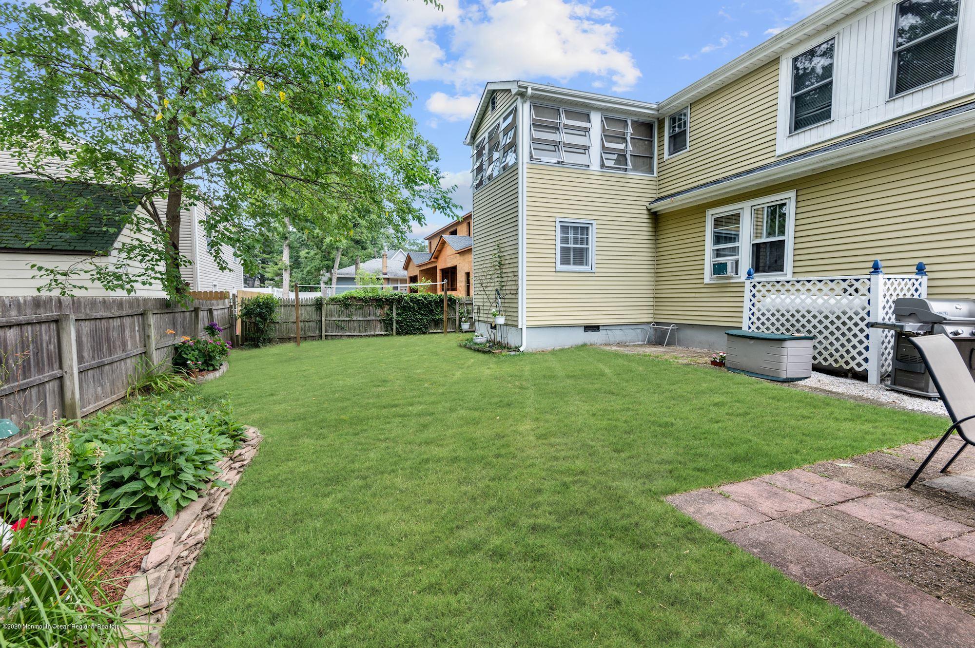 306 Cedar Road Point Pleasant, NJ 08742 - Photo 21 of 28 a backyard of a house with table and chairs