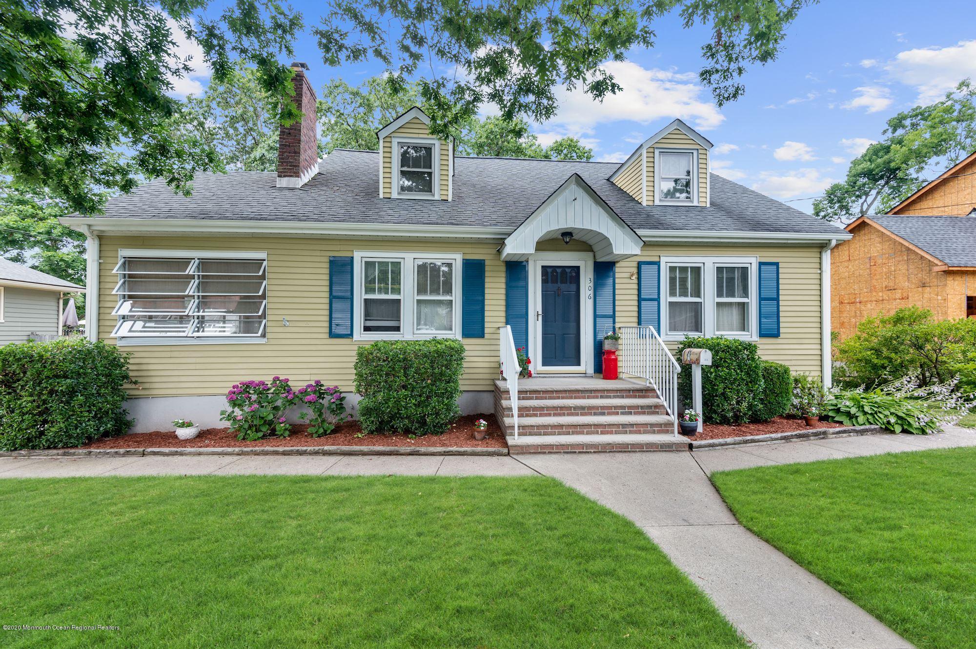 306 Cedar Road Point Pleasant, NJ 08742 - Photo 23 of 28 a front view of a house with a garden