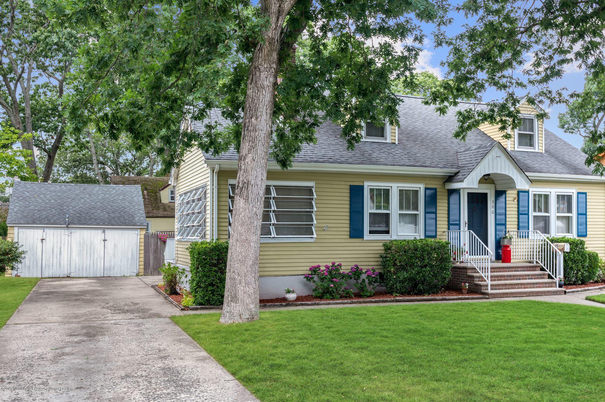 306 Cedar Road Point Pleasant, NJ 08742 - Photo 25 of 28 a front view of a house with a yard and trees