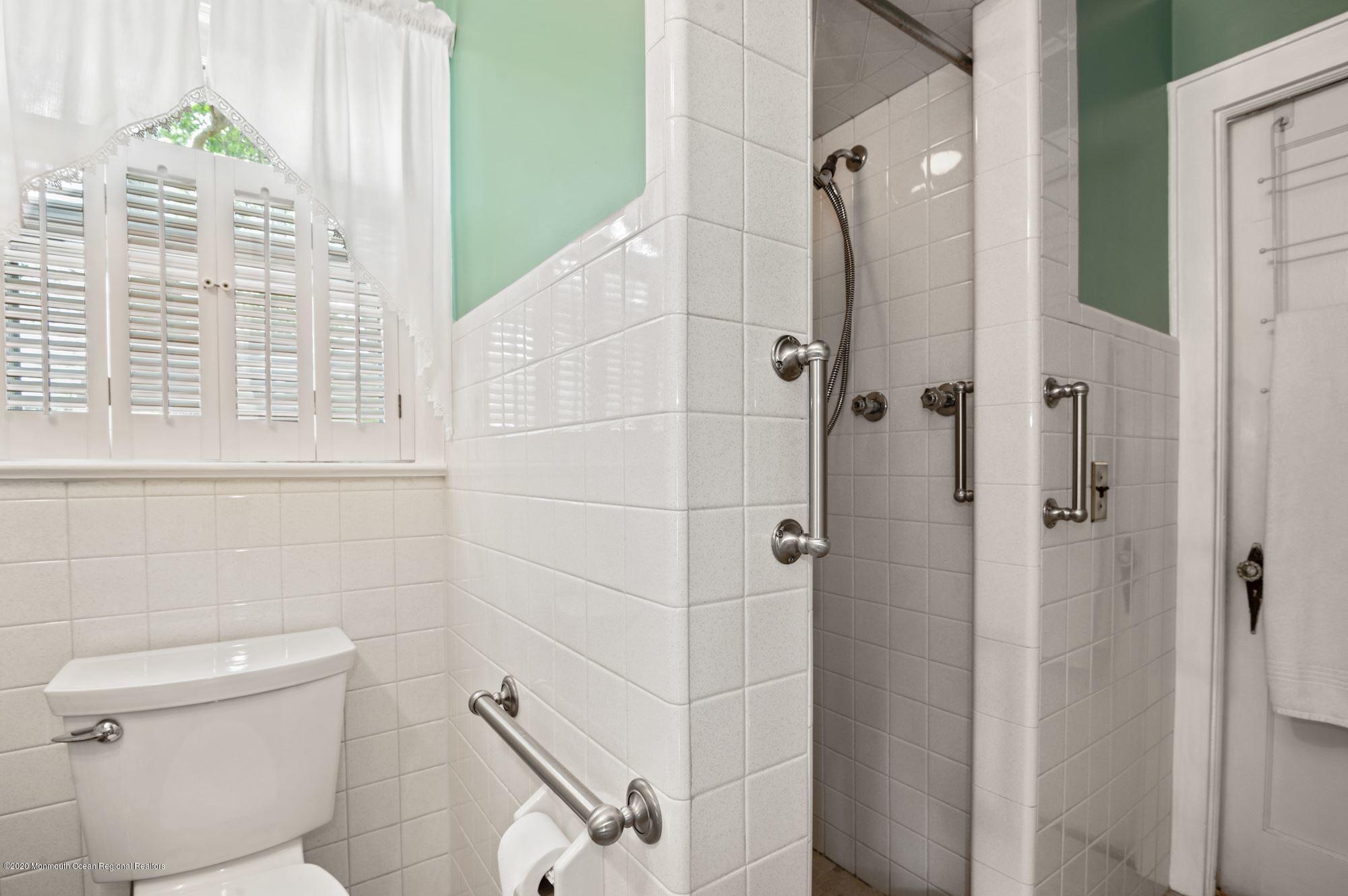 306 Cedar Road Point Pleasant, NJ 08742 - Photo 7 of 28 a bathroom with a shower and a toilet
