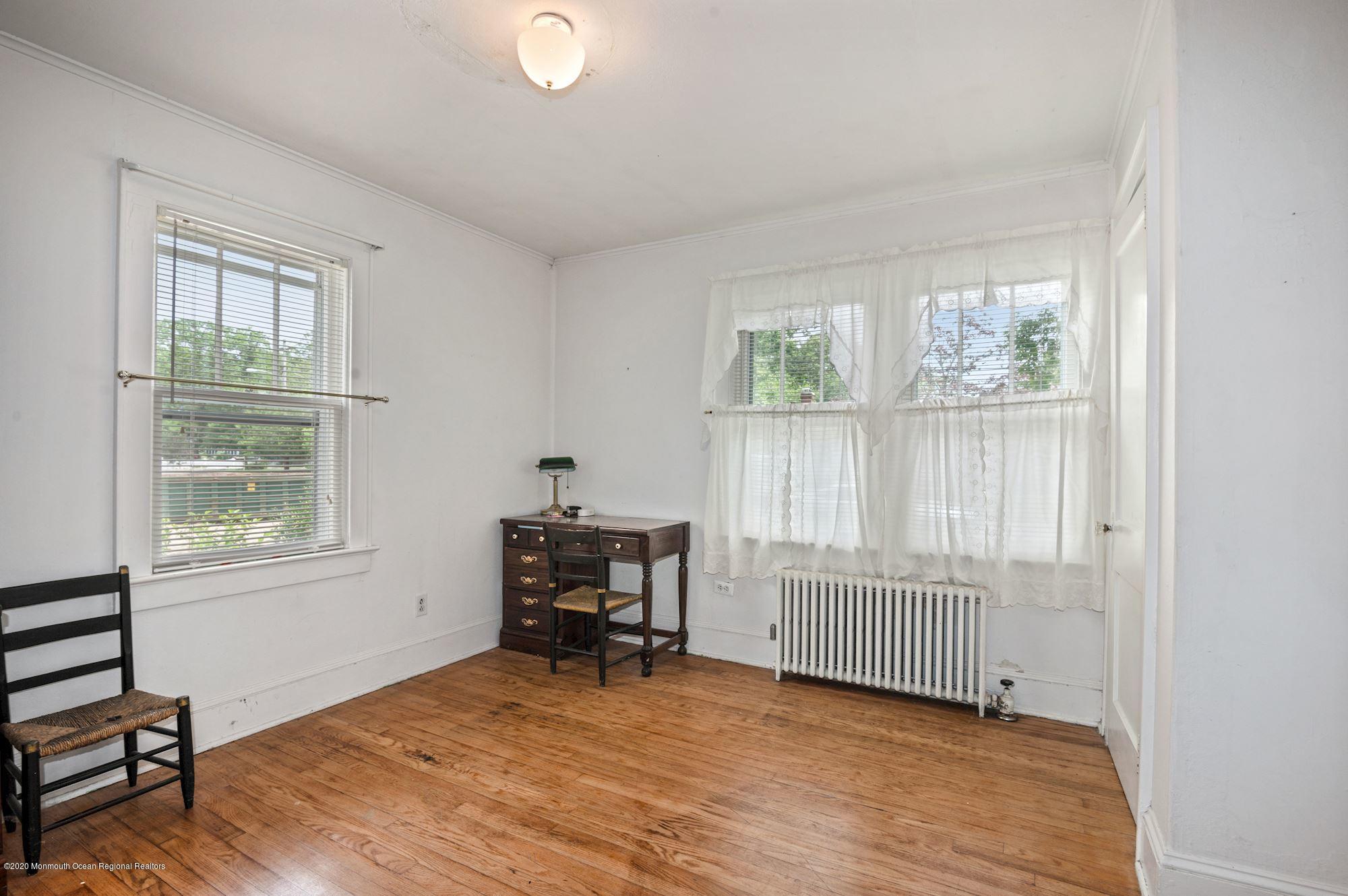 306 Cedar Road Point Pleasant, NJ 08742 - Photo 8 of 28 a view of an empty room with a window
