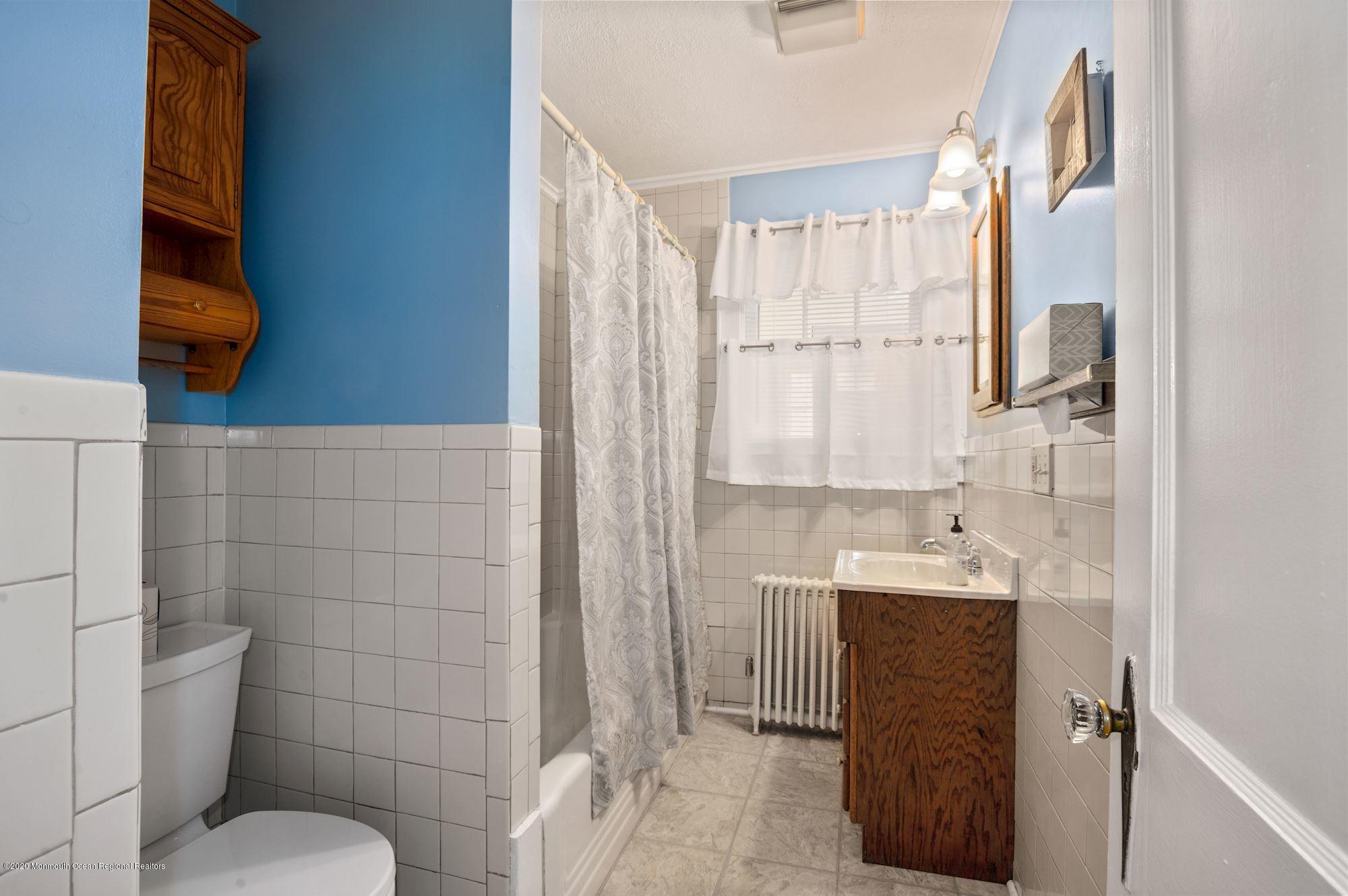 306 Cedar Road Point Pleasant, NJ 08742 - Photo 9 of 28 a bathroom with a sink toilet and shower
