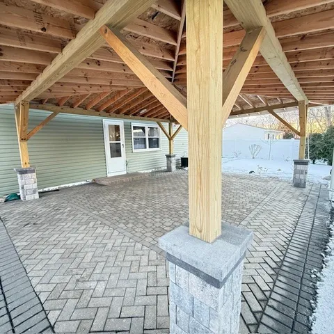 a view of a backyard with pathway