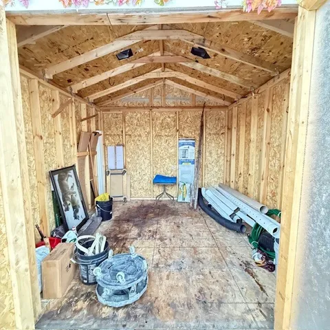 a view of a house with a snow on the road