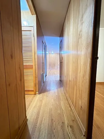 a view of gallery with wooden floor