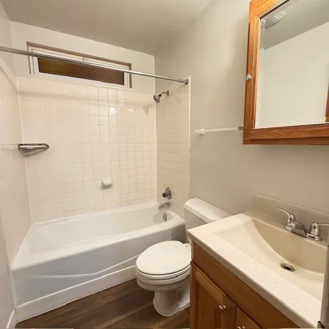 a bathroom with a sink a toilet and a bathtub