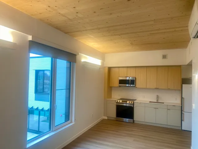 a kitchen with a sink and a stove top oven