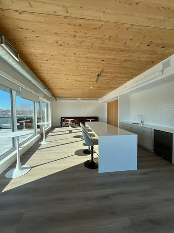 a view of a dining room with furniture and window