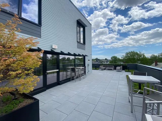 a view of a terrace with sitting area