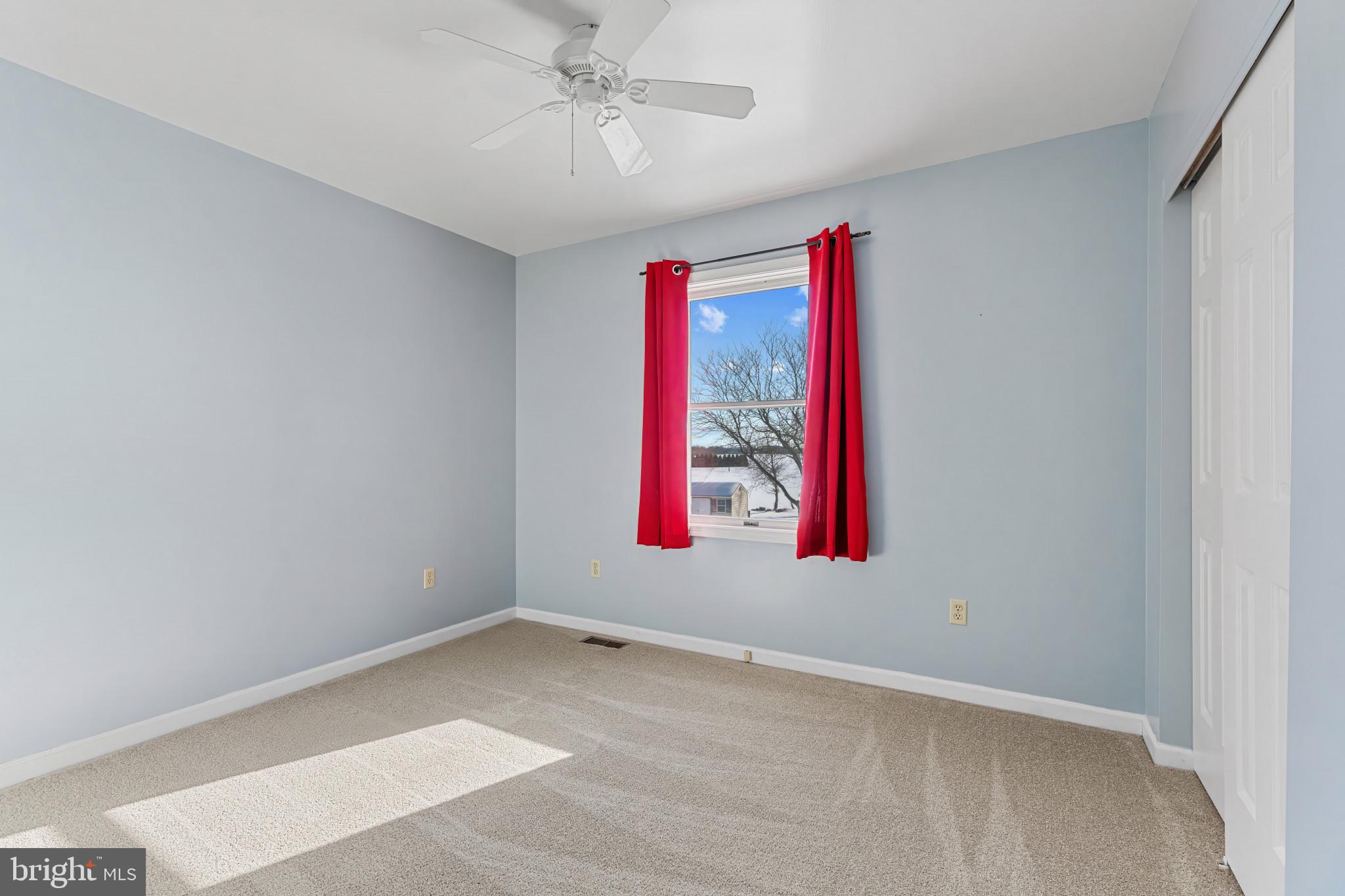 14525 John Peel Road Galena, MD 21635 - Photo 20 of 31 an empty room with window and fan
