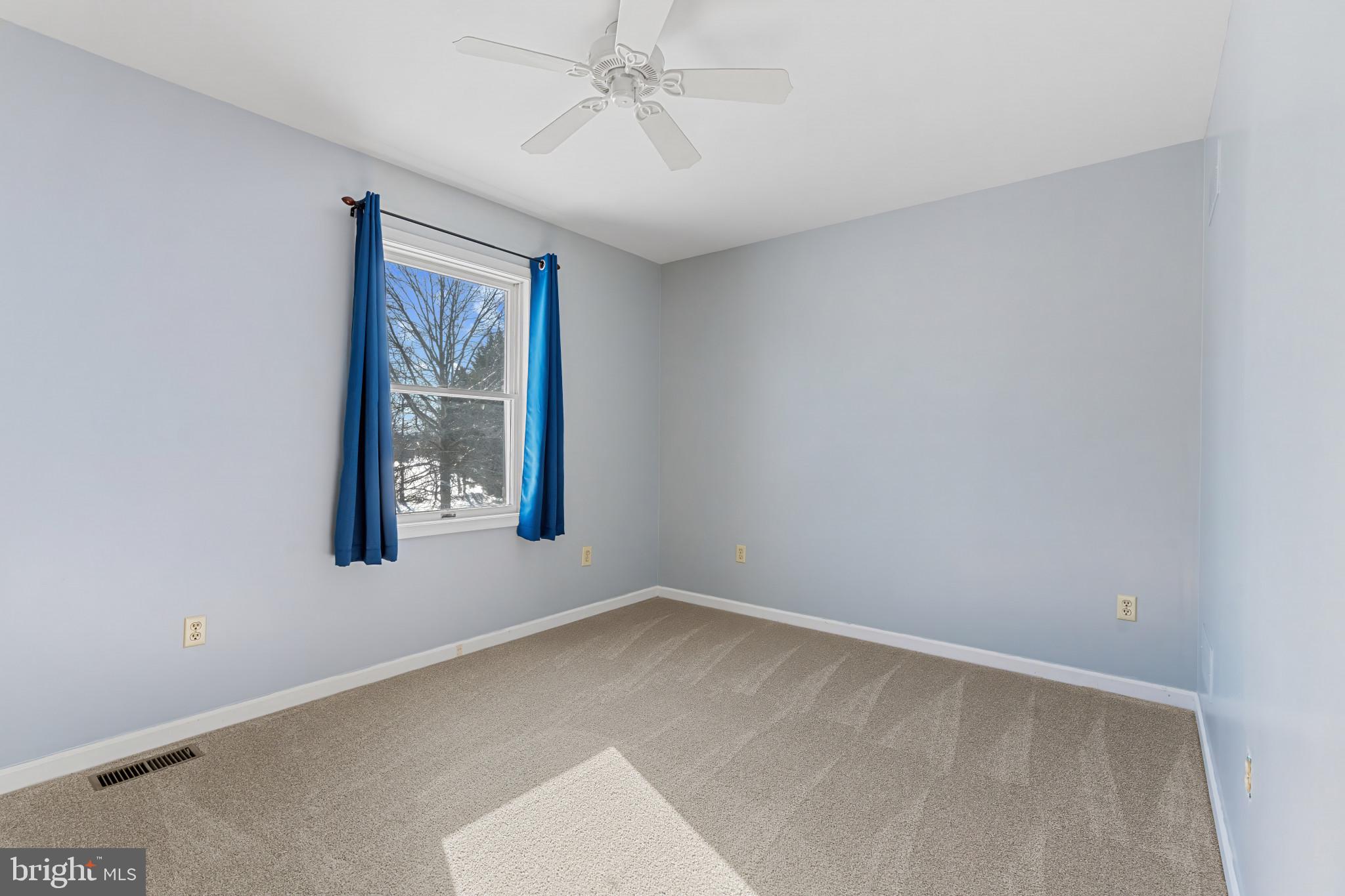 14525 John Peel Road Galena, MD 21635 - Photo 24 of 31 an empty room with windows and fan