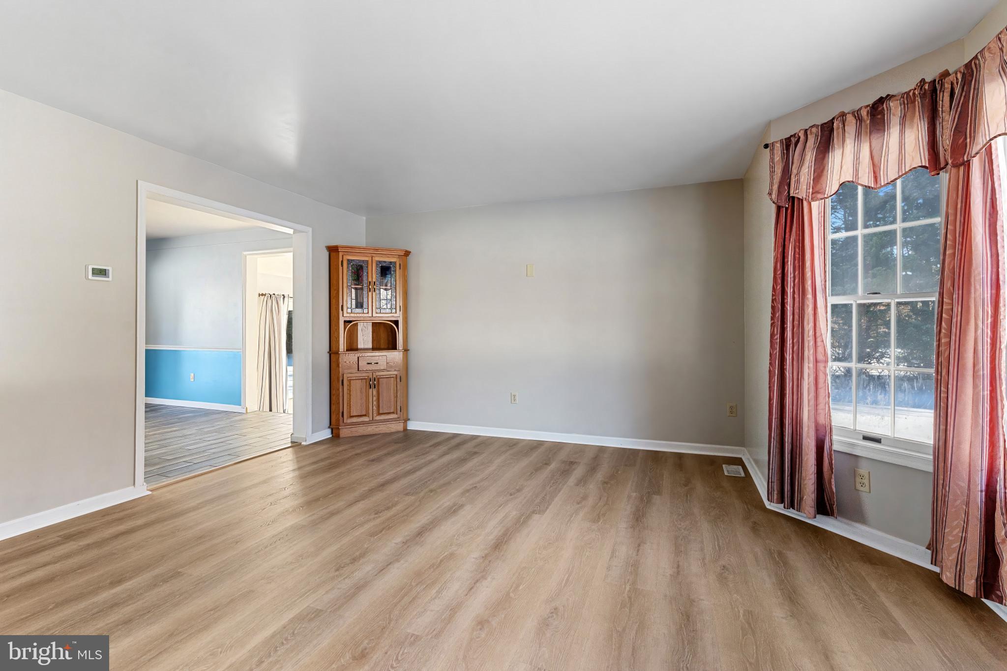 14525 John Peel Road Galena, MD 21635 - Photo 3 of 31 wooden floor in an empty room with a window