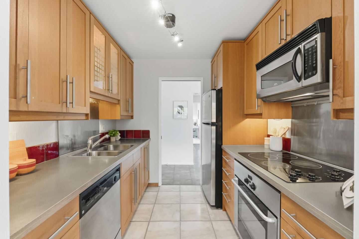 765 San Antonio Road, Unit 88 Palo Alto, CA 94303 - Photo 16 of 41 a kitchen with stainless steel appliances granite countertop a stove a sink and a refrigerator