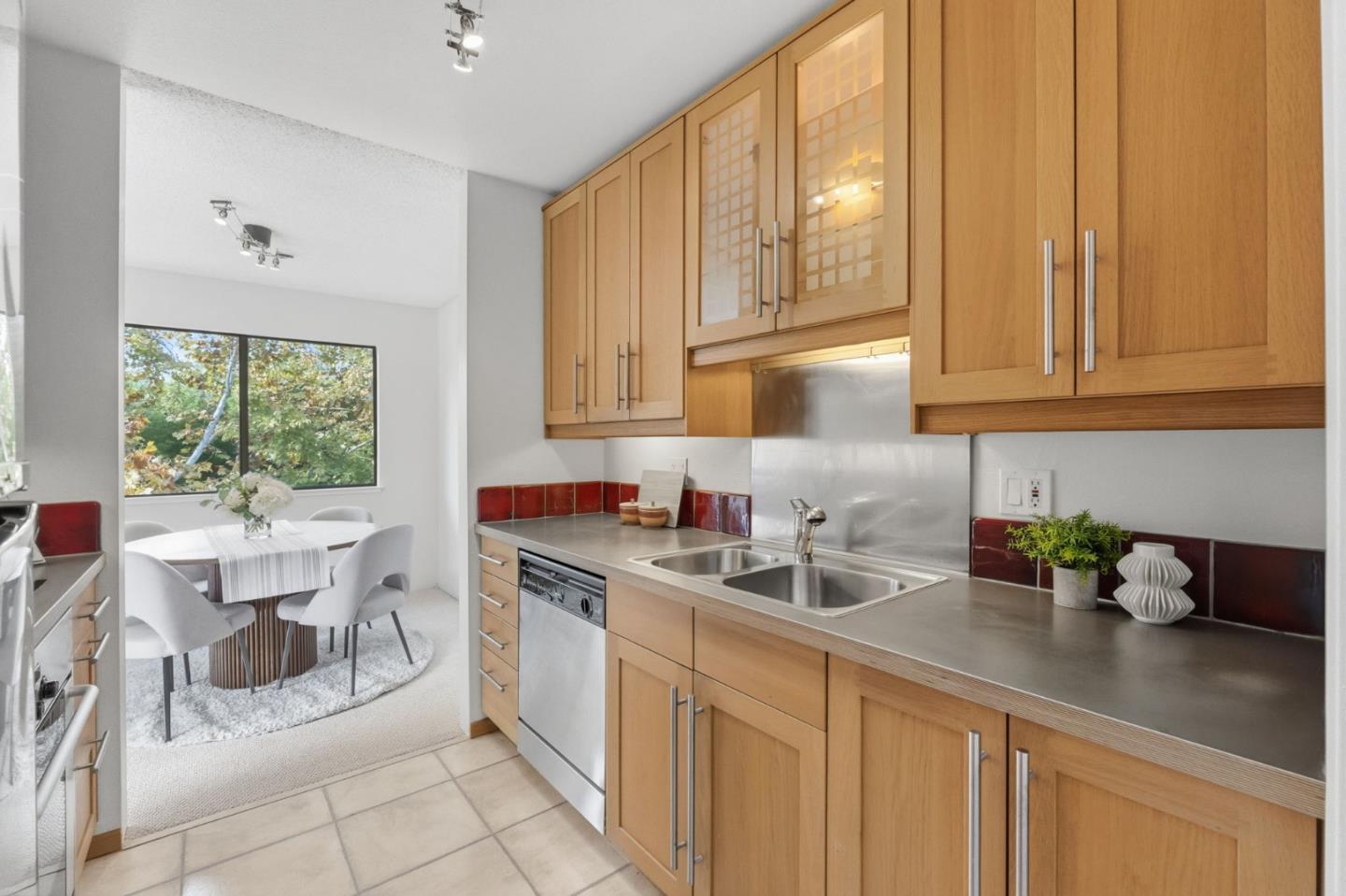 765 San Antonio Road, Unit 88 Palo Alto, CA 94303 - Photo 21 of 41 a kitchen with stainless steel appliances granite countertop a sink a stove and white cabinets