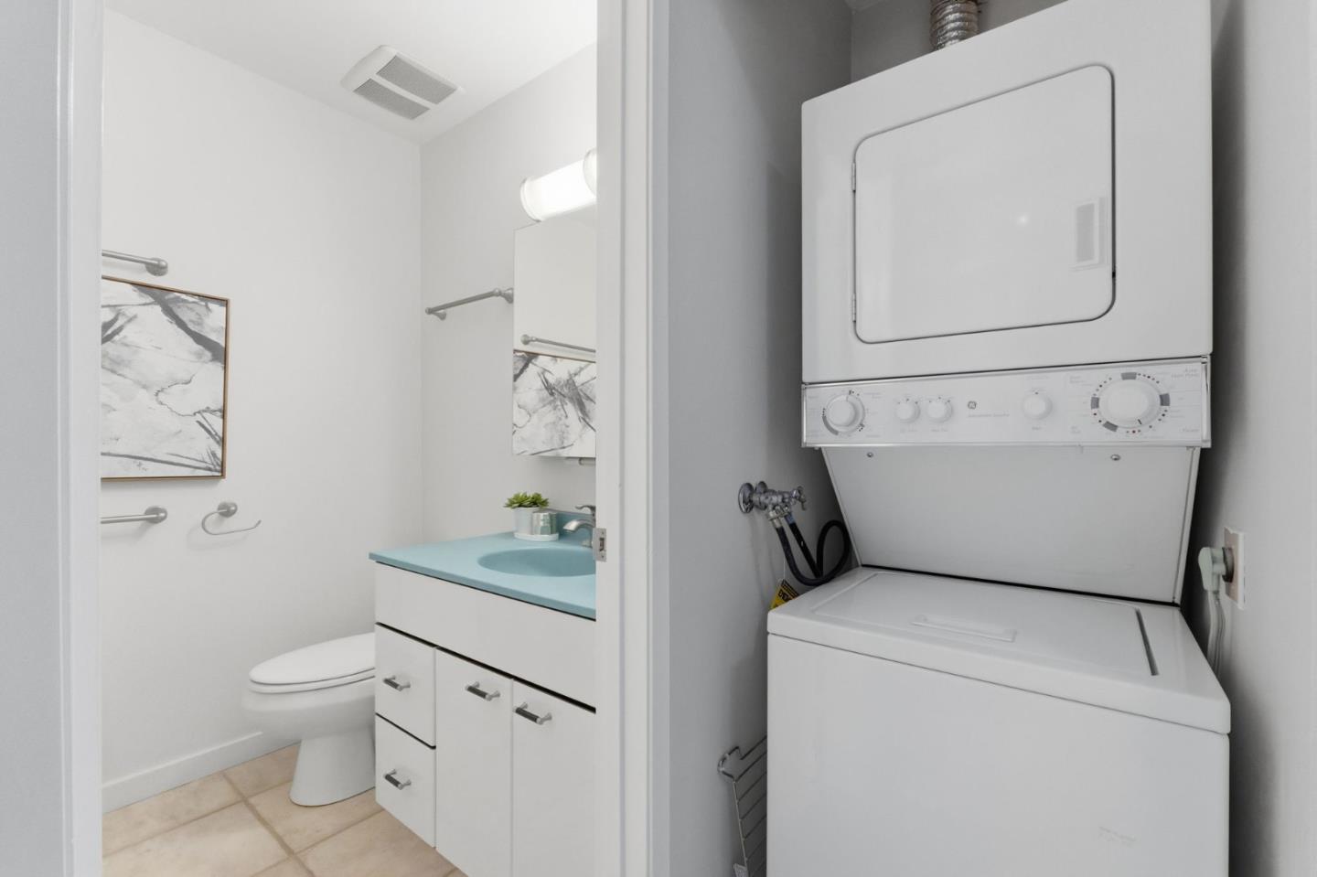 765 San Antonio Road, Unit 88 Palo Alto, CA 94303 - Photo 22 of 41 a bathroom with a granite countertop toilet sink and mirror