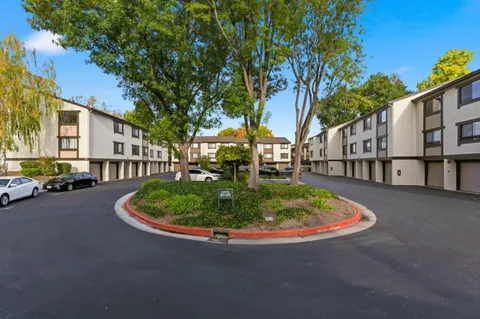 a backyard of a house with outdoor seating