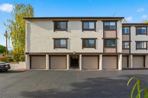 a front view of a house with a garage