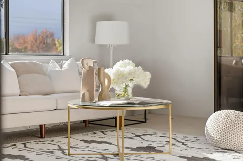 a dining room with furniture and wooden floor