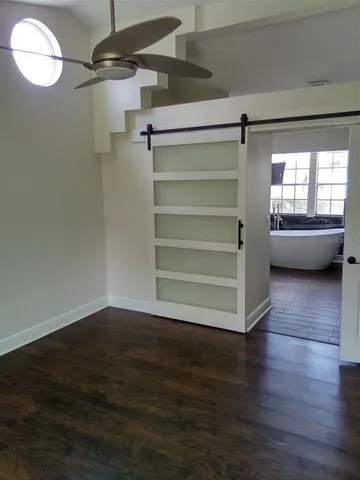 a view of an empty room with a window