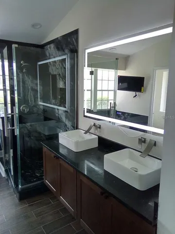 a bathroom with a sink and a mirror