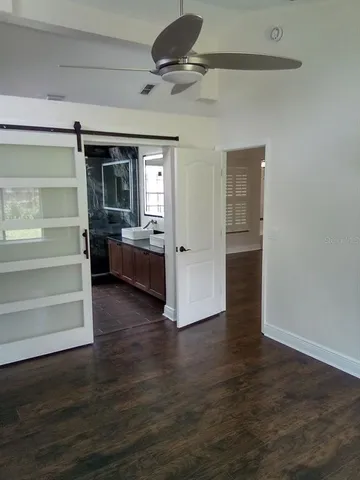 a view of a livingroom with furniture and a window