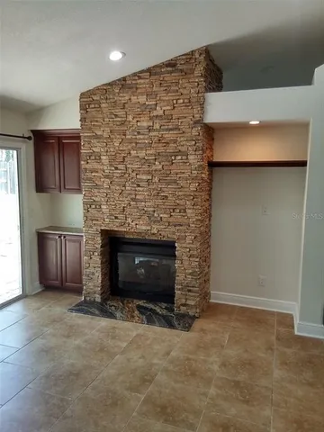 an empty room with a fireplace