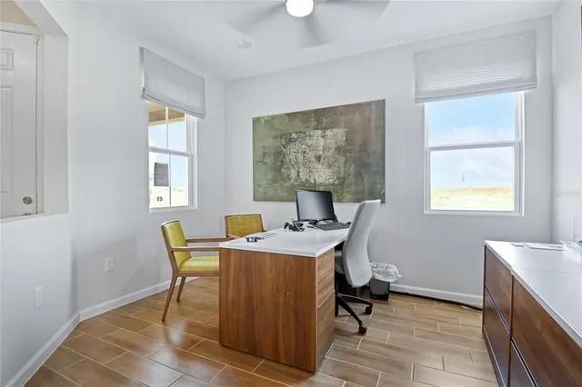 a dining room with furniture a window and appliances