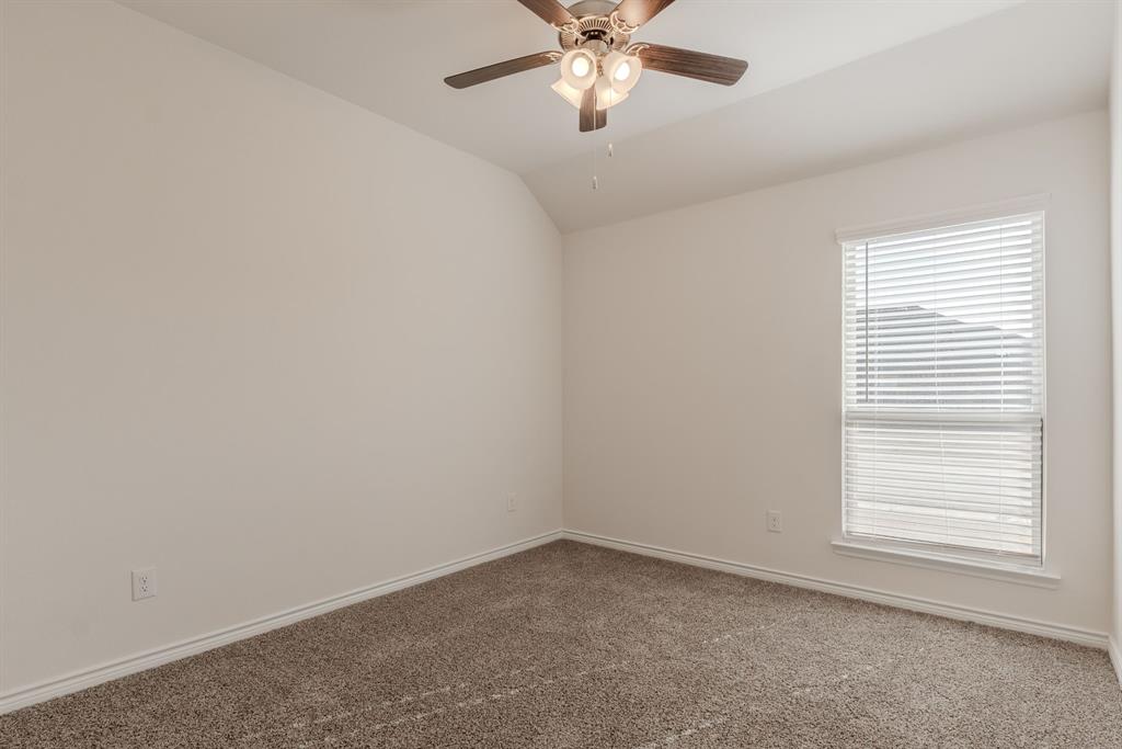 2902 Trusting Way Aubrey, TX 76227 - Photo 19 of 38 Neutral-toned carpeted room featuring a ceiling fan with light fixture, a window with blinds, white baseboards, and light-colored walls