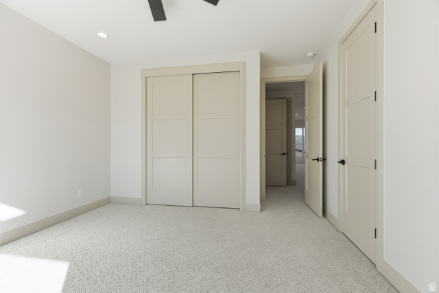 226 East 1100 North Hurricane, UT 84737 - Photo 44 of 49 Unfurnished bedroom with light colored carpet, a closet, recessed lighting, and ceiling fan