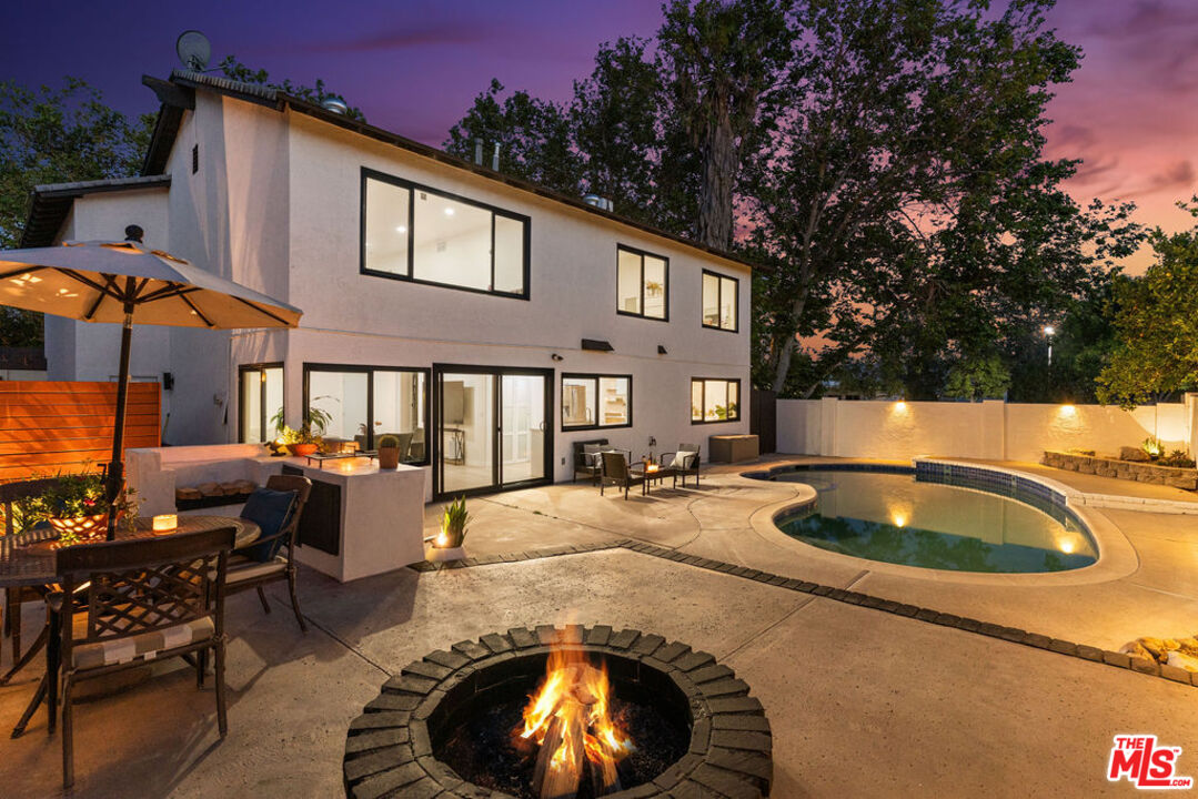 2313 Rynerson Court Simi Valley, CA 93065 - Photo 1 of 45 a backyard of a house with yard fire pit barbeque oven and outdoor seating