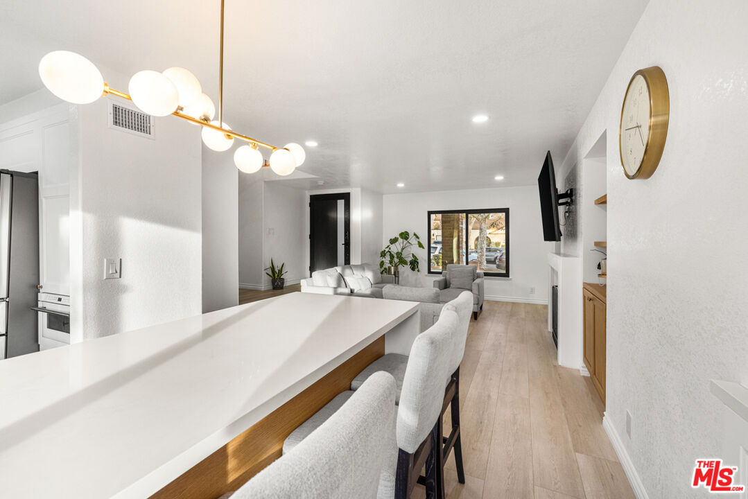 2313 Rynerson Court Simi Valley, CA 93065 - Photo 11 of 45 a dining hall with stainless steel appliances granite countertop furniture and fireplace