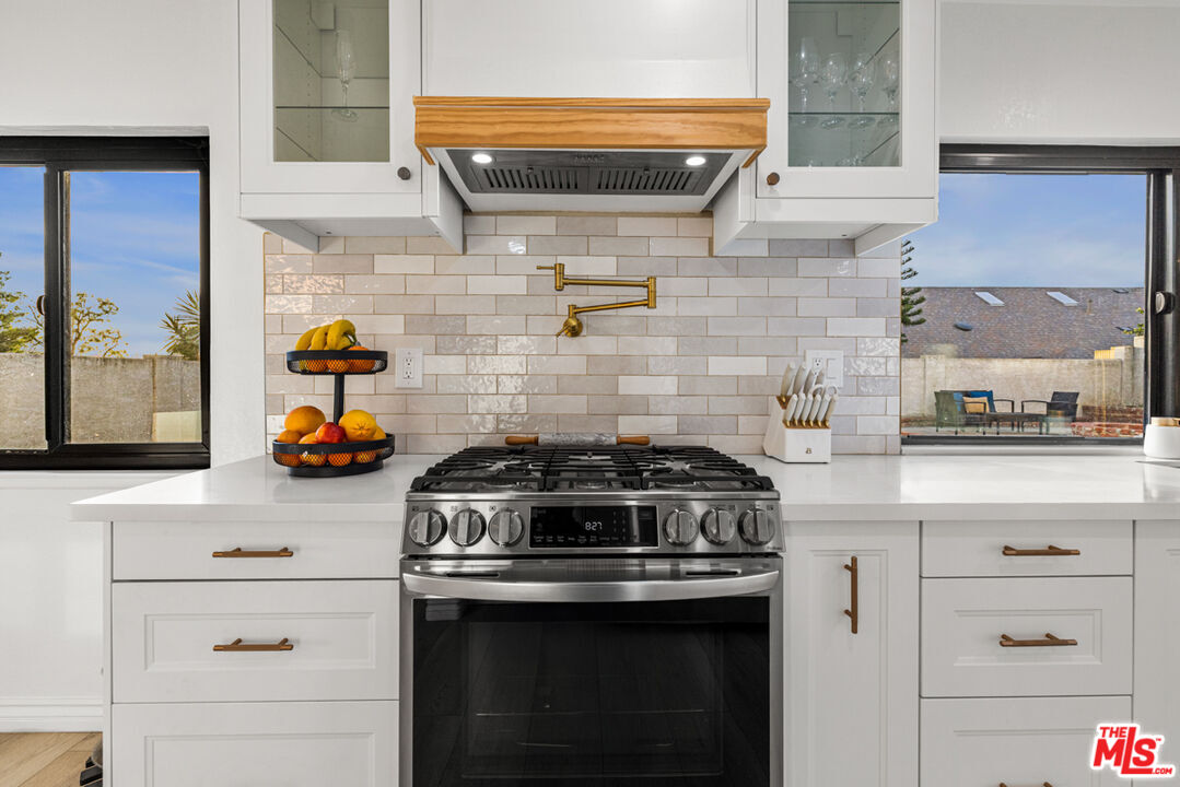 2313 Rynerson Court Simi Valley, CA 93065 - Photo 16 of 45 a stove top oven sitting inside of a kitchen