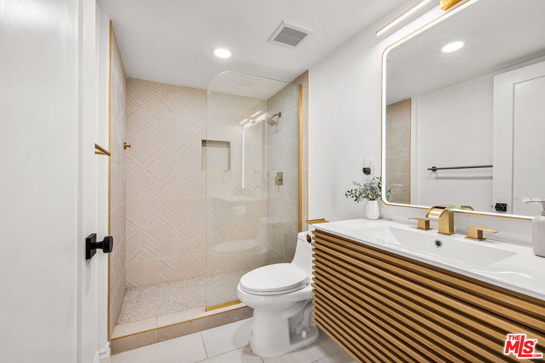 2313 Rynerson Court Simi Valley, CA 93065 - Photo 20 of 45 a bathroom with a sink a toilet and shower