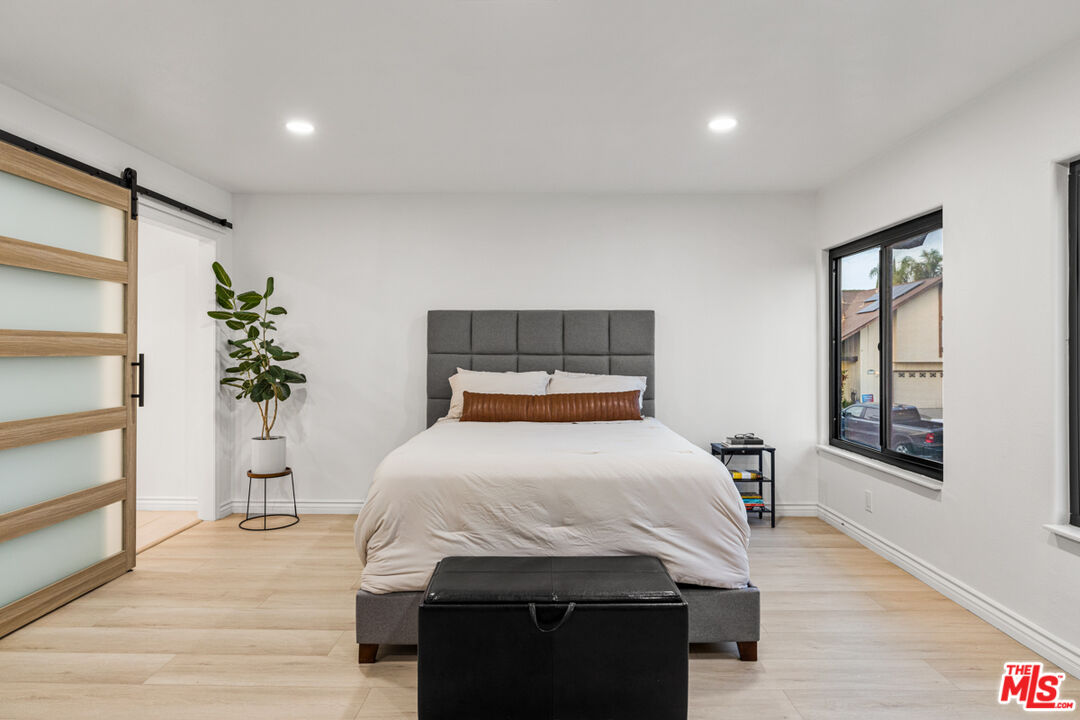 2313 Rynerson Court Simi Valley, CA 93065 - Photo 25 of 45 a bedroom with a bed and a potted plant