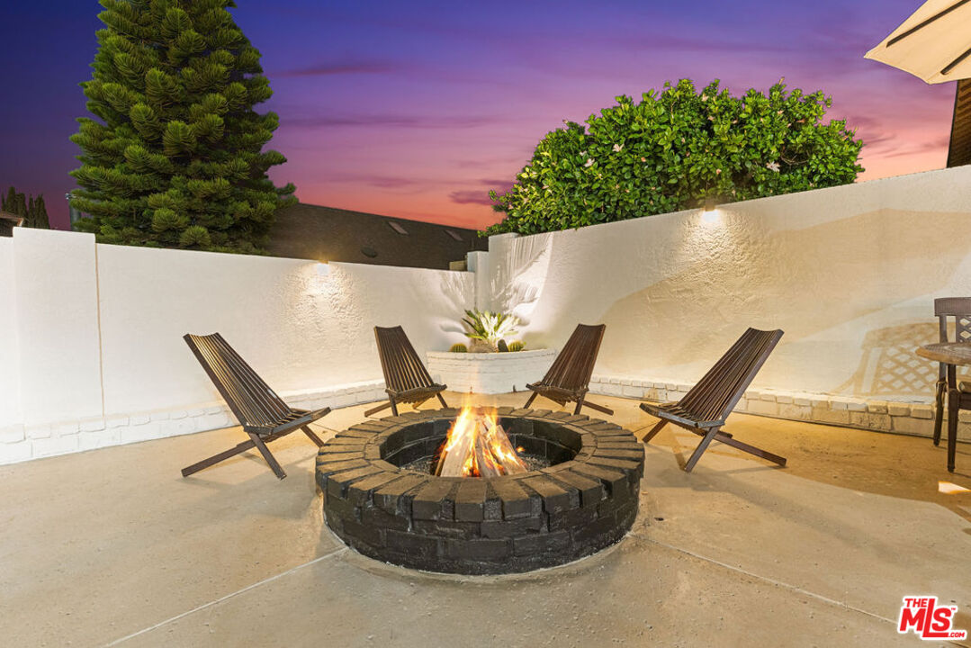 2313 Rynerson Court Simi Valley, CA 93065 - Photo 3 of 45 a view of a patio with table and chairs and potted plants