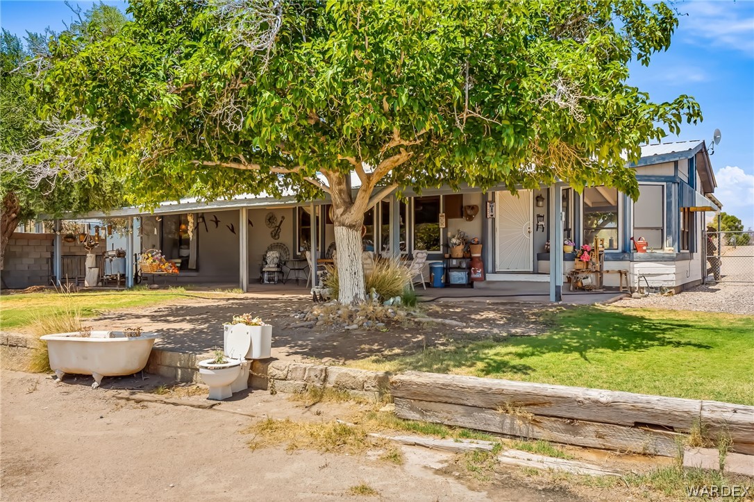 10031 Dike Road Mohave Valley, AZ 86440 - Photo 42 of 78 a view of a house with backyard and sitting area