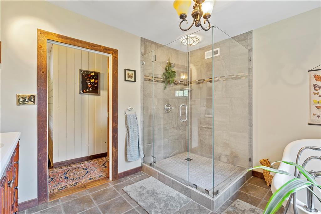 299 Forbes Trail Road Greensburg, PA 15601 - Photo 22 of 42 a bathroom with a shower a mirror and a shower