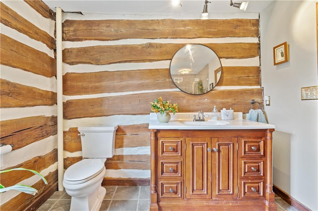 299 Forbes Trail Road Greensburg, PA 15601 - Photo 23 of 42 a bathroom with a toilet a sink and a mirror