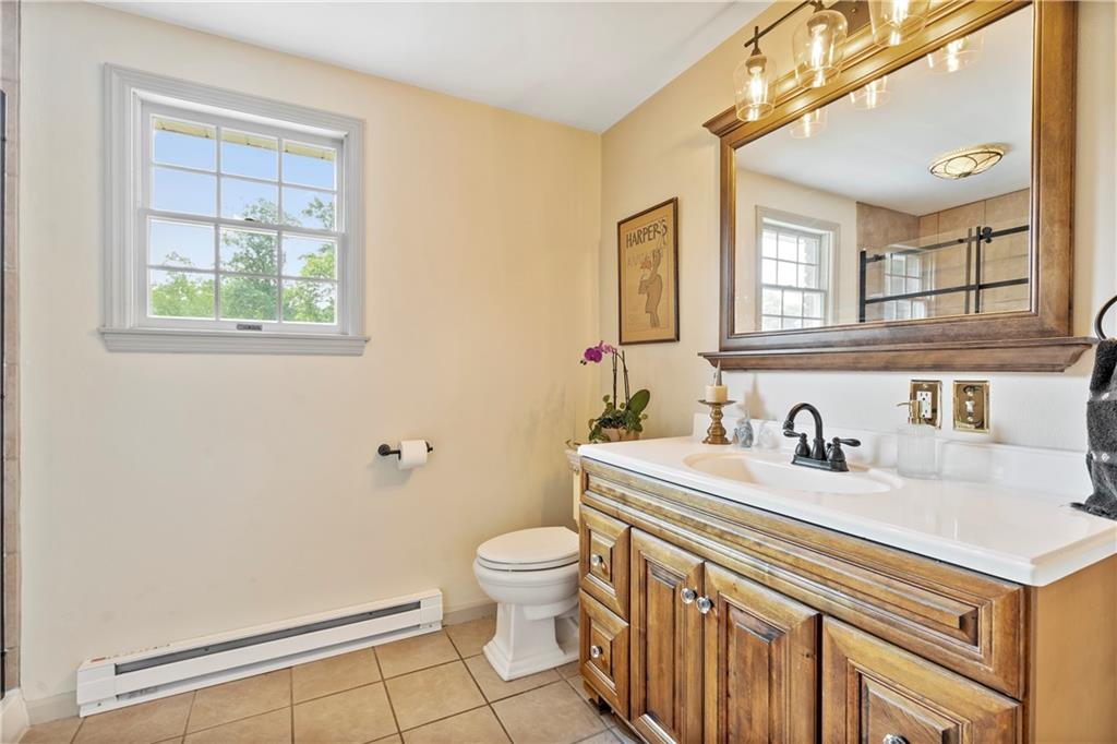 299 Forbes Trail Road Greensburg, PA 15601 - Photo 31 of 42 a bathroom with a sink a toilet and a mirror