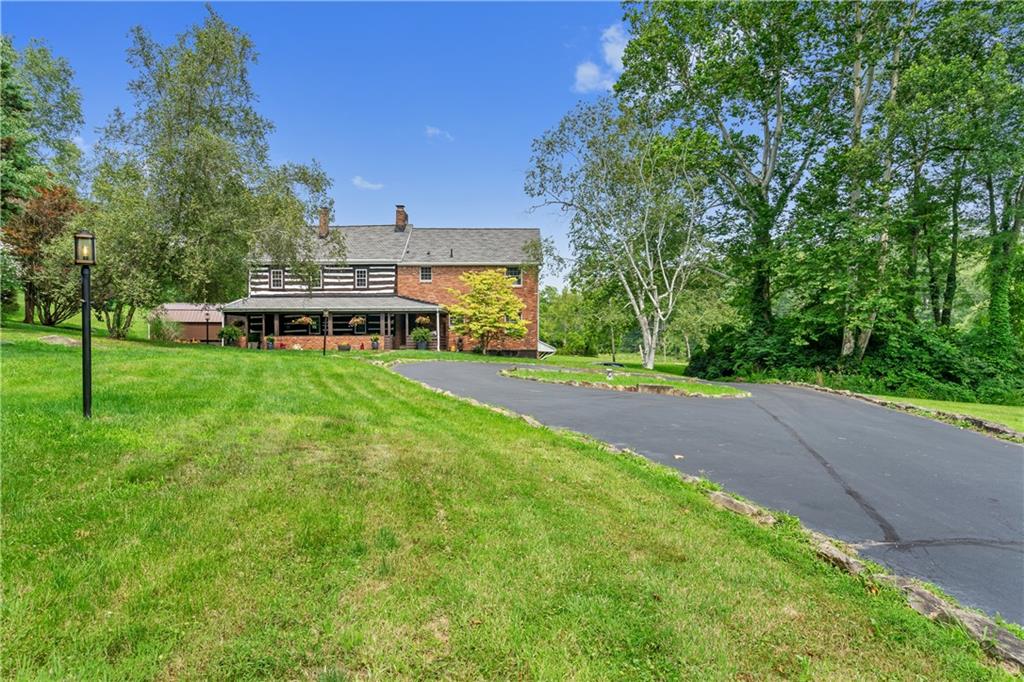 299 Forbes Trail Road Greensburg, PA 15601 - Photo 38 of 42 a view of a house with a yard porch and sitting area